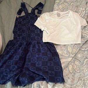 It’s a two piece the shirt does come with the overalls